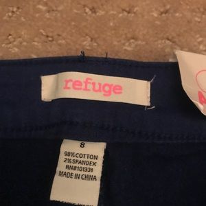 Dark blue, almost violet colored jeans.